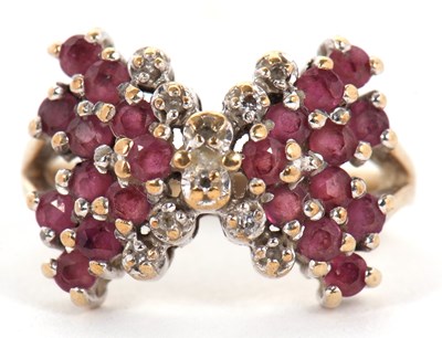 Lot 2 - A 9ct ruby and diamond bow ring, the bow set...