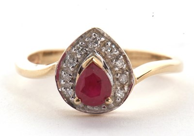 Lot 6 - A 9ct ruby and diamond ring, the central pear...