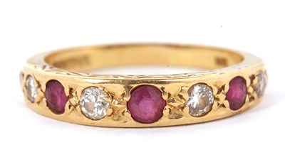 Lot 11 - A 9ct ruby and diamond ring, set with...
