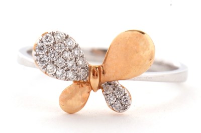 Lot 8 - A two tone 18ct diamond butterfly ring, the...