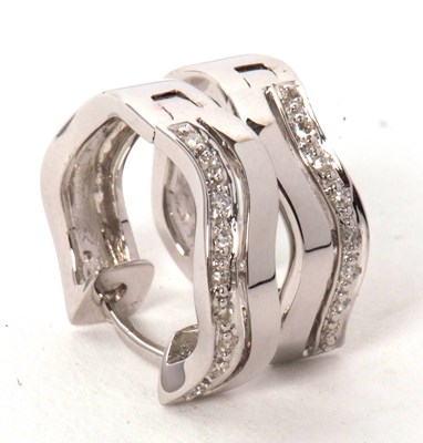 Lot 62 - A pair of 9ct and diamond earrings, the hoops...