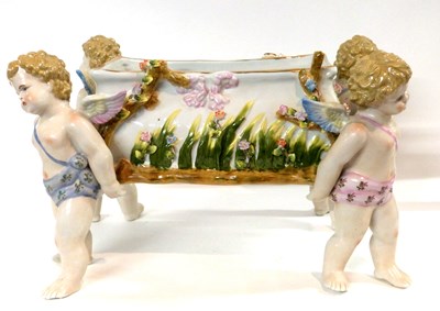 Lot 322 - A continental porcelain jardiniere, the four...