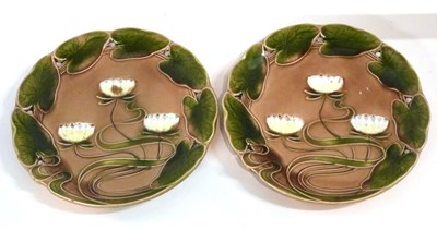 Lot 354 - A pair of German pottery Art Nouveau plates...