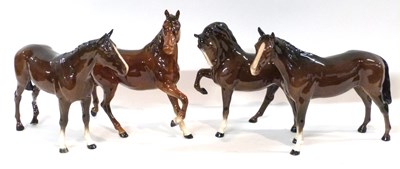 Lot 404 - A group of four Beswick horses (one with leg a/f)