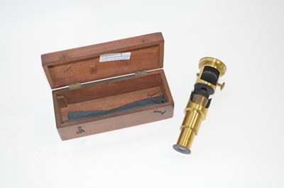Lot 406 - A small microscope in wooden case