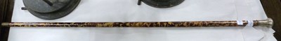 Lot 493 - A tortoiseshell and white metal topped walking...
