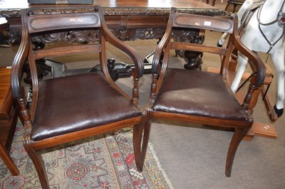 Lot 503 - A pair of Georgian mahogany sabre leg carver...