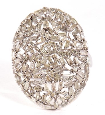 Lot 26 - A diamond plaque ring, the oval plaque set...