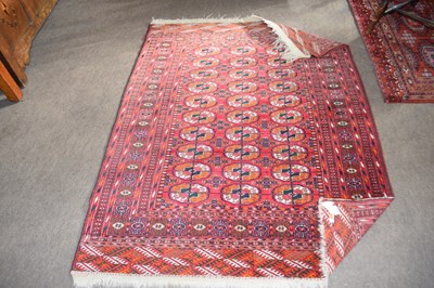 Lot 602 - A Bocara type wool floor rug with central...