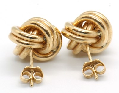 Lot 90 - A pair of 18ct knot style earrings, approx....