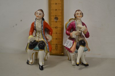 Lot 66 - Pair of miniature continental porcelain seated...