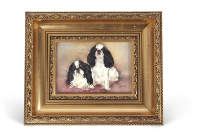Lot 20 - A gilt framed porcelain plaque of Pekingese...