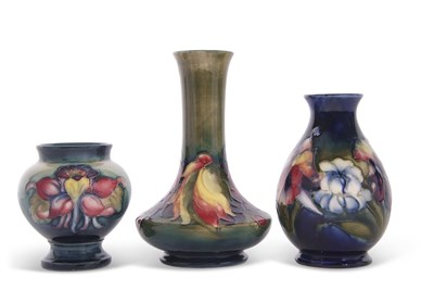Lot 49 - A group of three small Moorcroft vases, one...