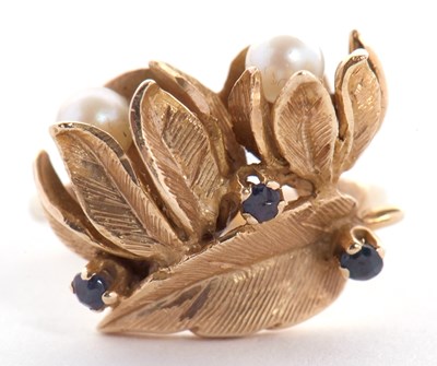 Lot 30 - A cultured pearl and sapphire floral ring, the...