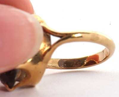 Lot 29 - A smokey quartz ring, the oval mixed cut...