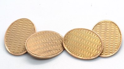 Lot 182 - A pair of 9ct cufflinks, the oval discs with...