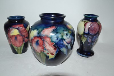 Lot 396 - Group of three small Moorcroft vases, the blue...