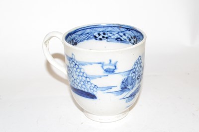 Lot 409 - A Caughley cup with blue and white castle...