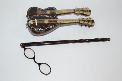 Lot 458 - Small tortoiseshell model of a guitar and one...