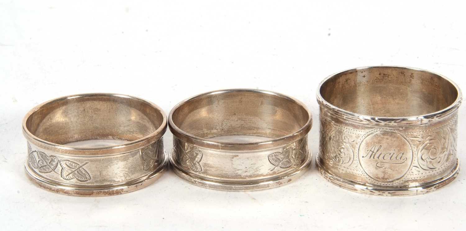 Lot 85 - A boxed pair of silver serviette rings, chased...