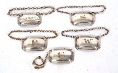 Lot 91 - A group of five vintage metal spirit labels,...
