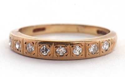 Lot 12 - A 9ct diamond ring, the half hoop set with...