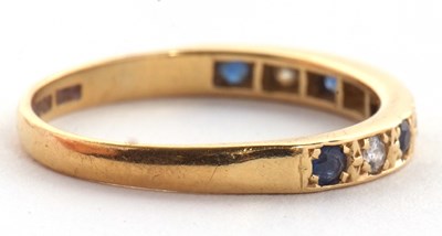 Lot 56 - An 18ct sapphire and diamond ring, the half...