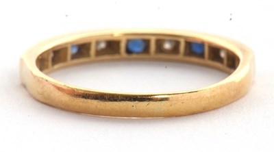 Lot 56 - An 18ct sapphire and diamond ring, the half...