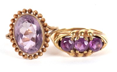 Lot 72 - Two amethyst rings, the first an oval collet...