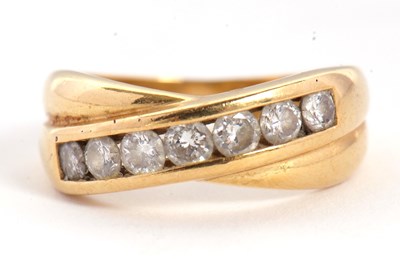 Lot 64 - An 18ct diamond crossover ring, with a two...
