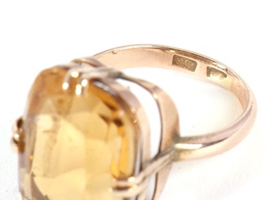 Lot 27 - A 9ct citrine ring, the oval mixed cut citrine,...