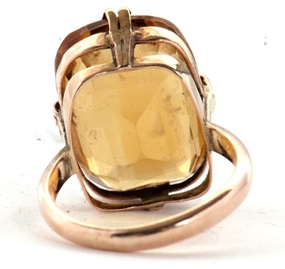 Lot 27 - A 9ct citrine ring, the oval mixed cut citrine,...
