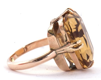 Lot 27 - A 9ct citrine ring, the oval mixed cut citrine,...