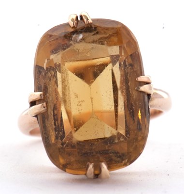 Lot 27 - A 9ct citrine ring, the oval mixed cut citrine,...