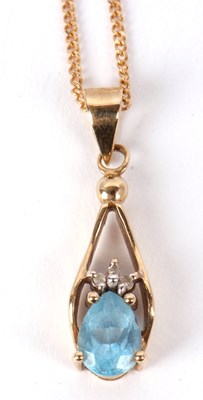 Lot 117 - A 9ct topaz pendant and chain, the pear shape...