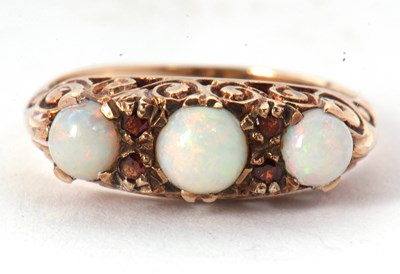 Lot 1 - A 9ct opal and garnet ring, the three slightly...