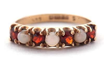Lot 41 - A 9ct garnet and opal ring, set with...