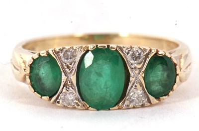 Lot 53 - A 9ct emerald and diamond ring, the three...
