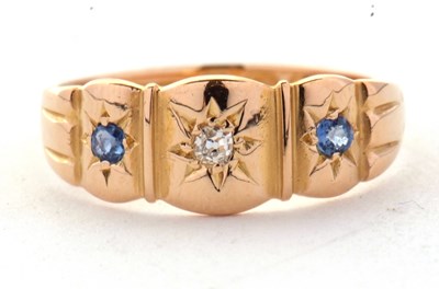 Lot 60 - An 18ct sapphire and diamond ring, the central...