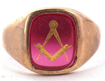 Lot 31 - A 9ct Masonic ring, the red glass panel with...