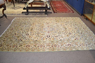 Lot 582 - A modern Kashan carpet decorated with floral...
