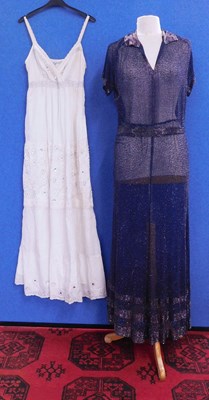 Lot 44 - A navy blue chiffon heavily beaded dress with...