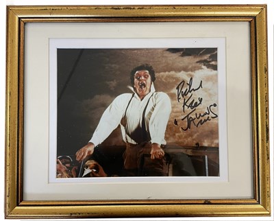 Lot 76 - A framed and glazed colour photograph, bearing...