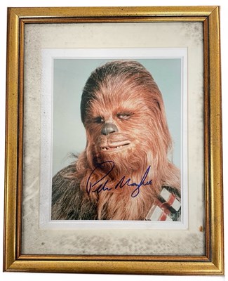 Lot 60 - A framed and glazed colour photograph bearing...