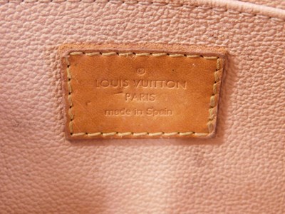 Lot 130 - A Louis Vuitton purse, half moon shape with...