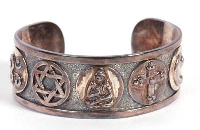 Lot 197 - A 'Quincy Jones Foundation' silver cuff, the...