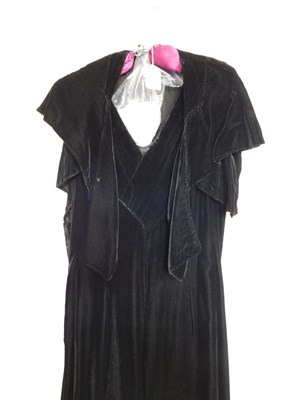 Lot 19 - A black velvet evening gown, the sleeveless...