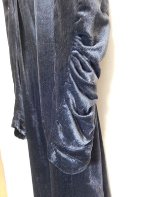 Lot 19 - A black velvet evening gown, the sleeveless...