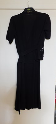 Lot 19 - A black velvet evening gown, the sleeveless...