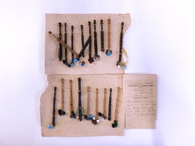 Lot 138 - An early 20th century card of lace bobbins, to...